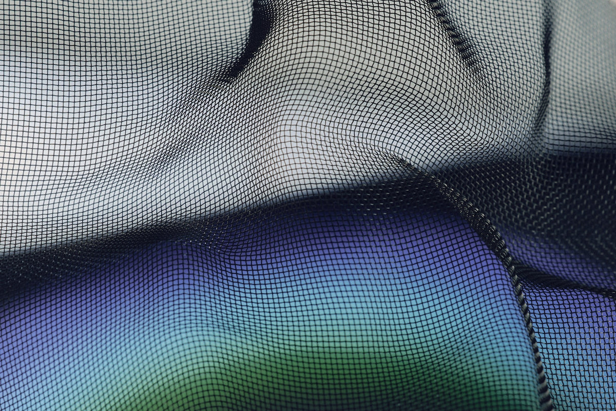 Close-up of blue and green metallic mesh fabric